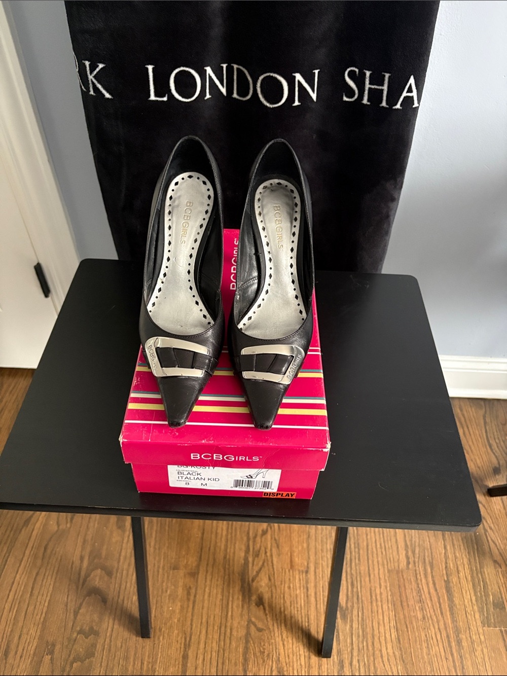 BCBGirls Black Pointed Toe Pumps with Silver Buckle